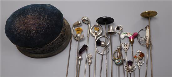 Seventeen assorted early 20th century and later hatpins including six silver by Charles Horner and a silver mounted hatpin cushion.